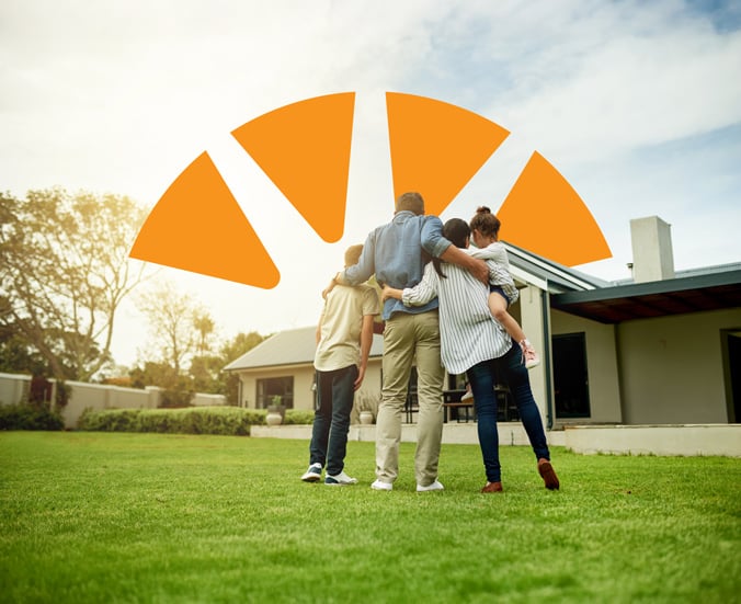 Family faces home with Dupaco burst above them