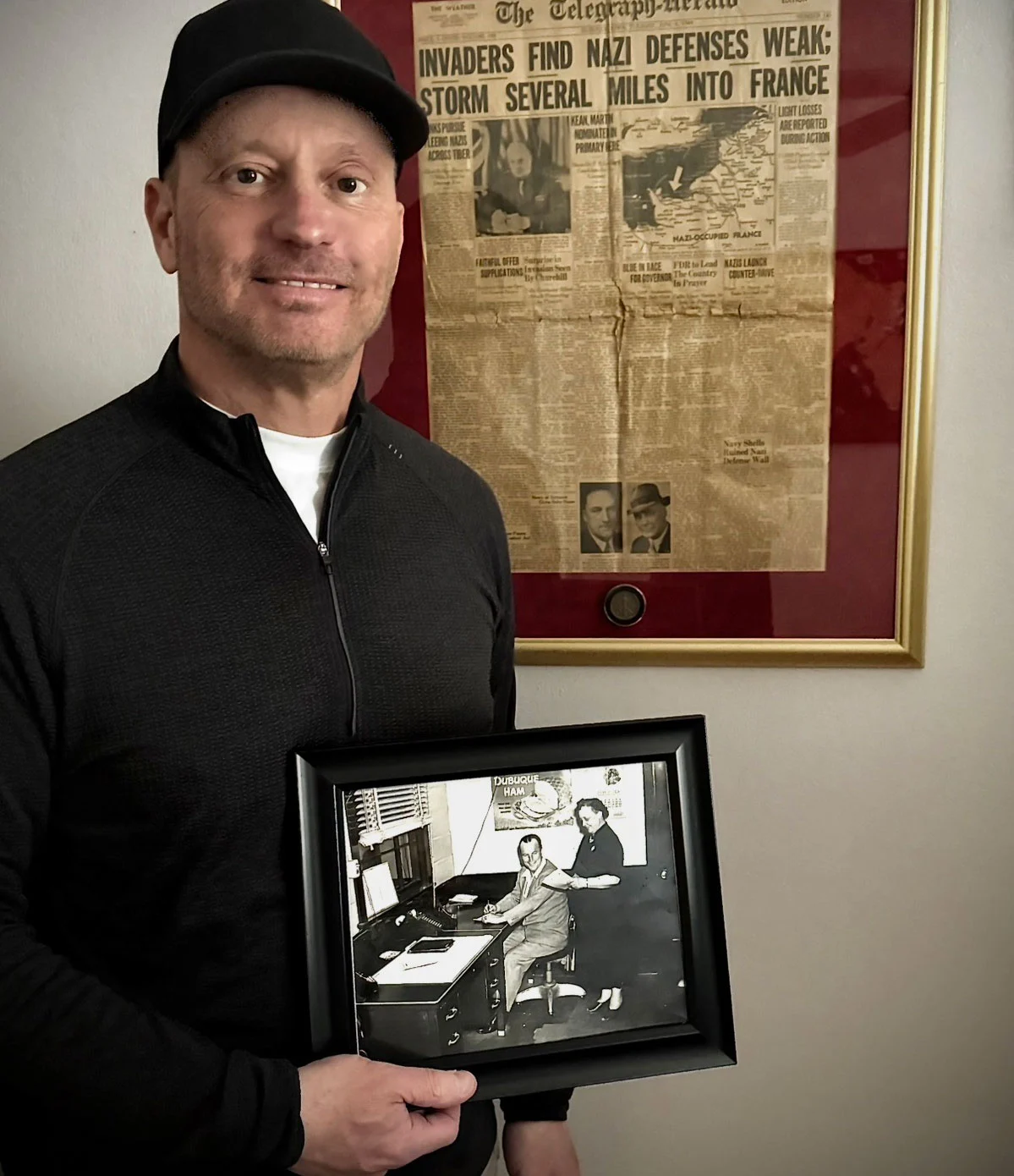 Dupaco member Kenneth Arthofer holds a historic photo of his grandmother, Gladys Arthofer, whose involvement on Dupaco's board of directors helped shape the credit union's early years.
