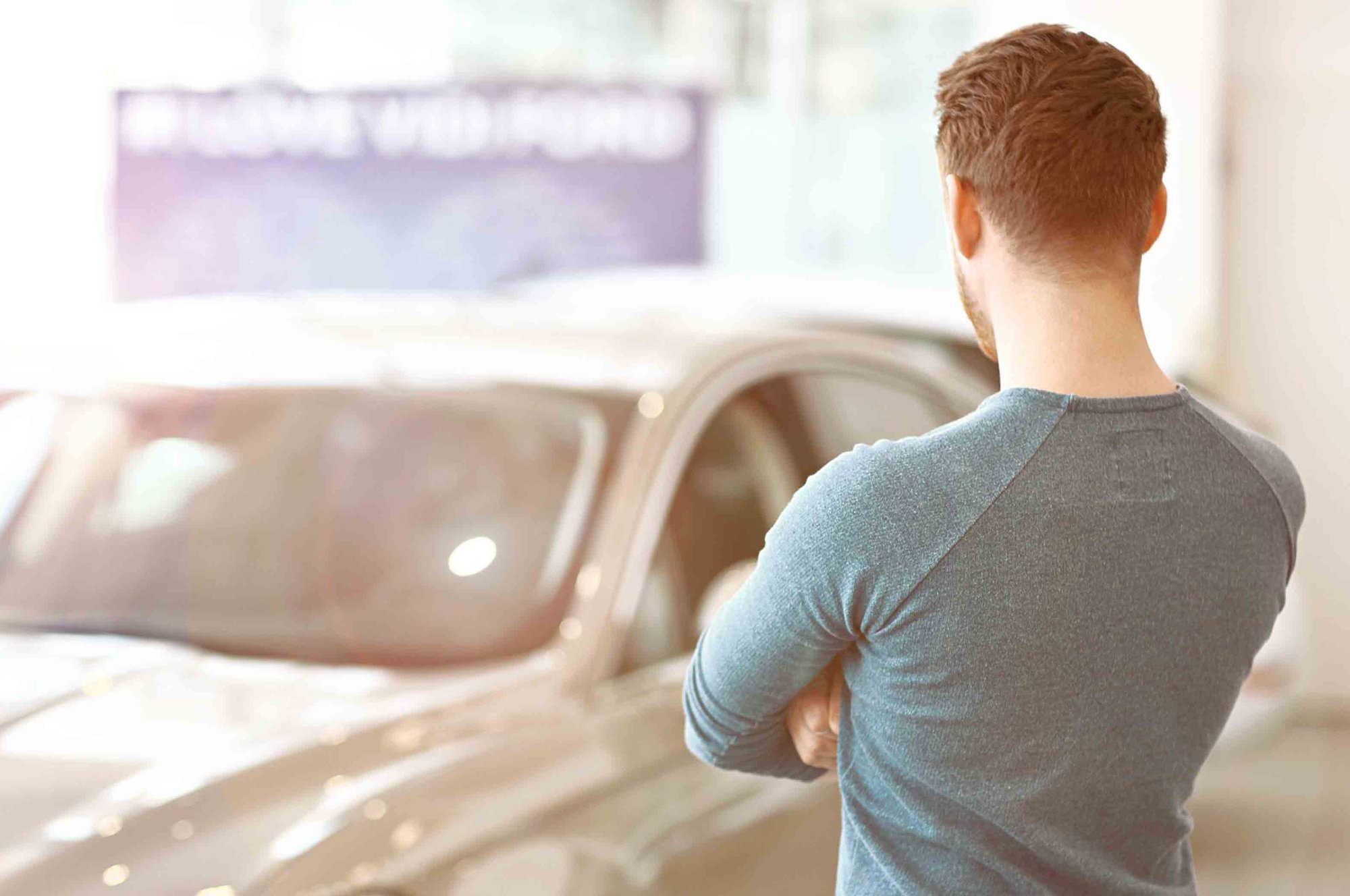 Young-man-car-buying-stock