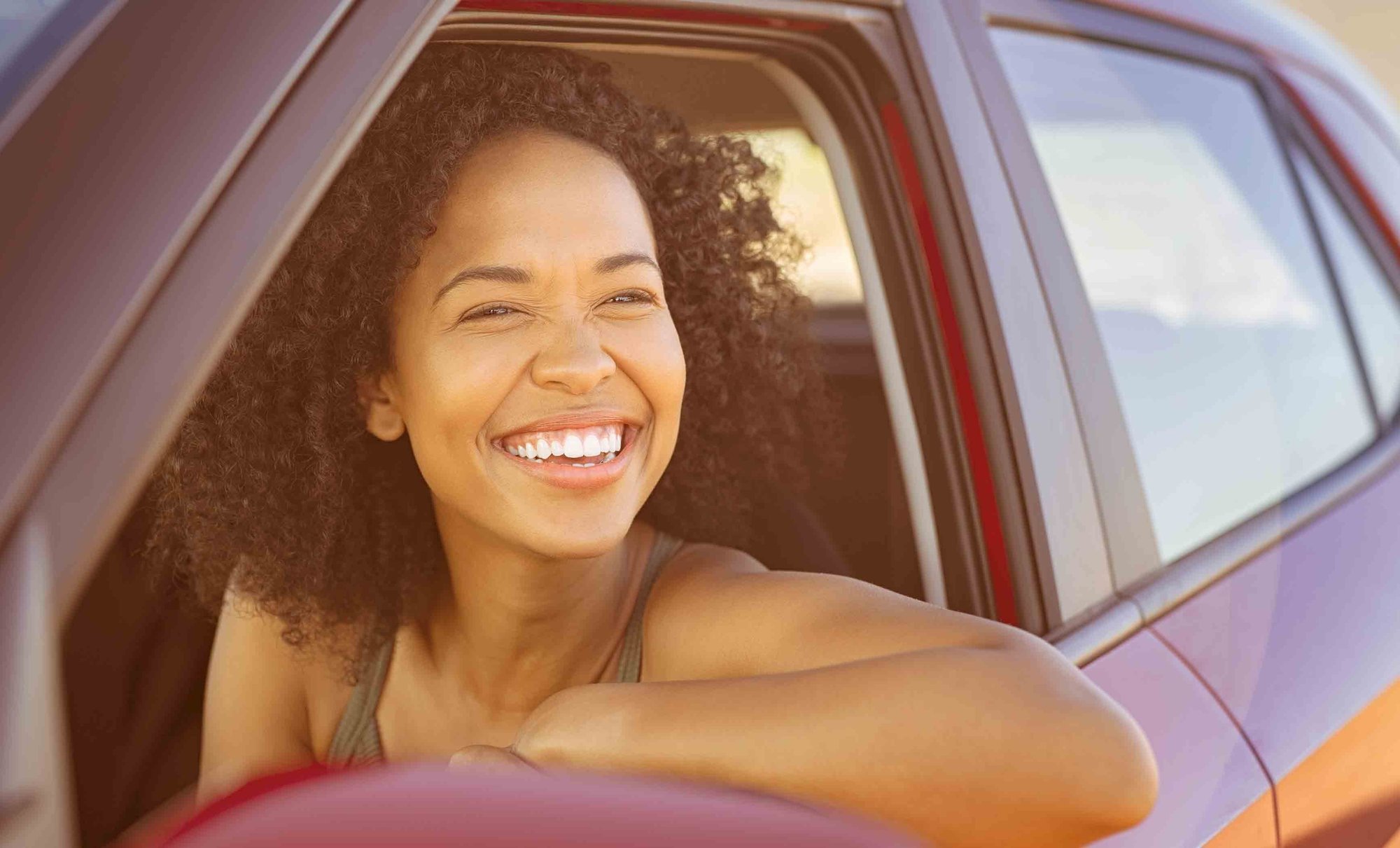 diverse-young-woman-carwindow-HGstock-676x338