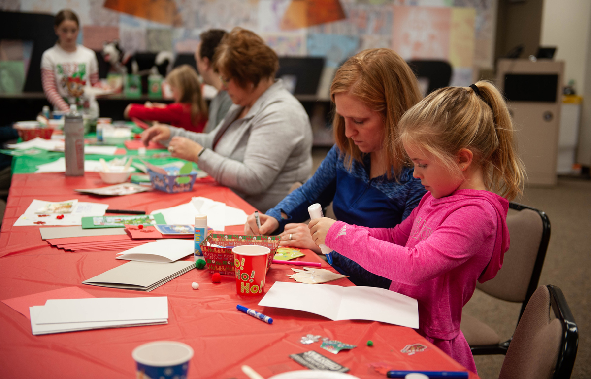 Dupaco staff and their families make holiday cards for Dubuque area nursing homes on Dec. 1, 2018 at the Pennsylvania Avenue branch in Dubuque, Iowa. (M. Blondin/Dupaco photo)