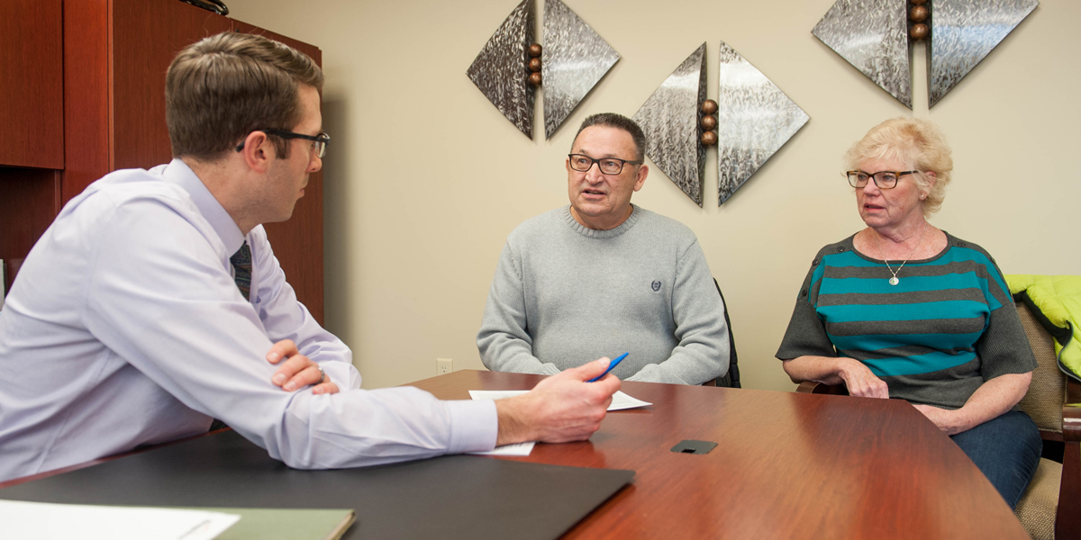 Dupaco members Wayne and Mary Konrardy meet with Michael Poppen from Dupaco Financial Services