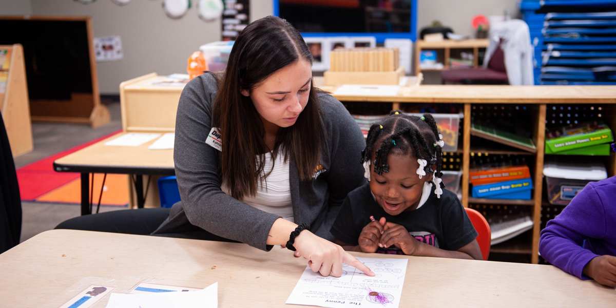 Students learn about pennies during a financial literacy lesson at Tri-County Head Start with Dupaco in Waterloo, Iowa.