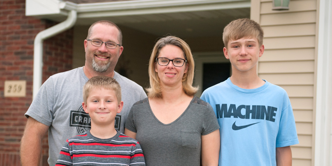 Dupaco members Jason and Cara Benn, with sons Griffin (right) and Landin, settle into their new home in Peosta, Iowa. (M. Blondin/Dupaco photo)