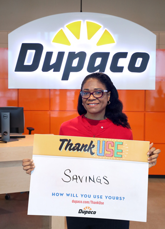 Dupaco member ReShonda Young, of Waterloo, Iowa, put her Thank Use cash dividend into her savings account. (B. Pollock photo)