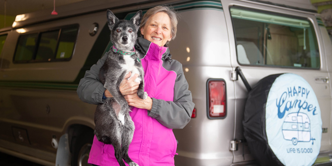 Dupaco member Sue Olsen, of Dubuque, Iowa, said Dupaco’s fraud services team listened to her concerns about buying a campervan she had agreed to purchase sight unseen—and offered her a way out of the sale. Ultimately, Olsen bought the vehicle, but is grateful for a credit union that always has her back. Also pictured: Olsen’s dog, BB. (M. Blondin/Dupaco photo)