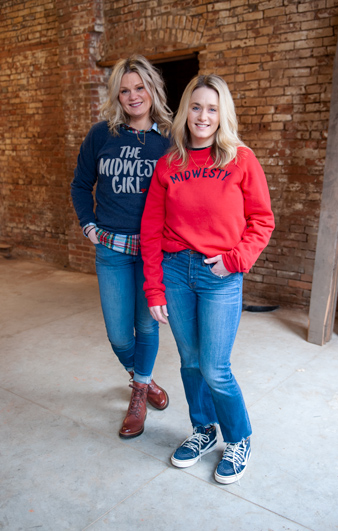 Sisters Marah Odgers and Marissa Hoffmann, co-owners of The Midwest Girl, pose for a photo on Jan. 22 as they check out their new store location in Dubuque, Iowa. The store will open in the Millwork District in spring 2020. (M. Blondin/Dupaco photo)