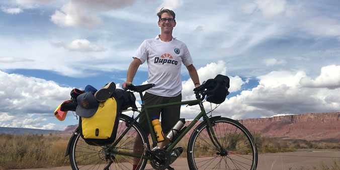 George Hofheimer, chief knowledge officer of the credit union think-tank Filene Research Institute, in Oct. 2018 represents Dupaco and Union Dubuque F.C. during a 425-mile solo bike ride from St. George, Utah to Phoenix, Arizona. Hofheimer—a collegiate soccer standout—wore the jersey sent to him by his friends at Dupaco. (Photo by George Hofheimer)