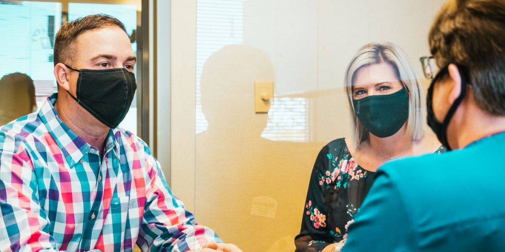 Members Chris and Jess Walters meet with Dupaco’s Carrie Minor at the Williams Boulevard branch in Cedar Rapids, Iowa. Minor helped the couple refinance two home loans—twice—as interest rates continued to drop in 2020. (B. Kaplan photo)