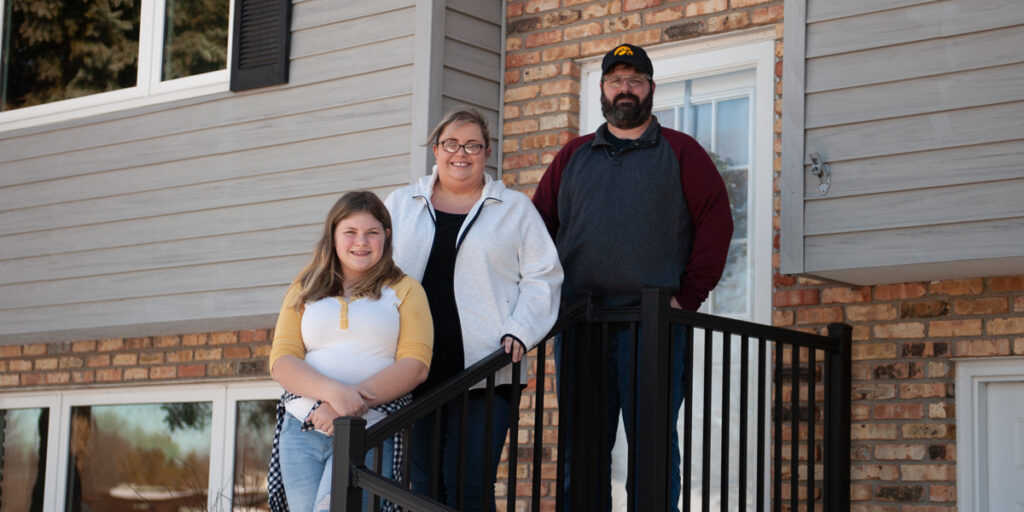 Members Stephanie and Jason Bergfeld settle into their new home with daughter, Natalie, in Dubuque, Iowa. (M. Blondin/Dupaco photo)