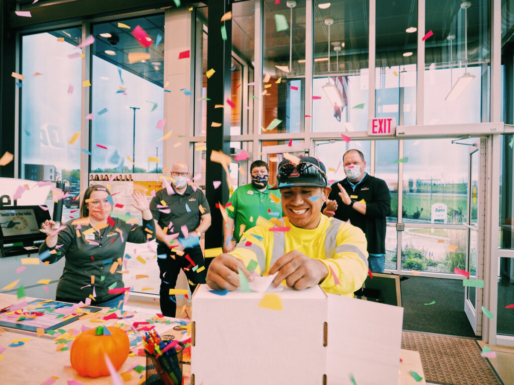 Member Ernesto Barrios participates in Dupaco’s Thank Use payout celebration while visiting the credit union's branch in Marion, Iowa, on Oct. 21. (B. Kaplan photo)