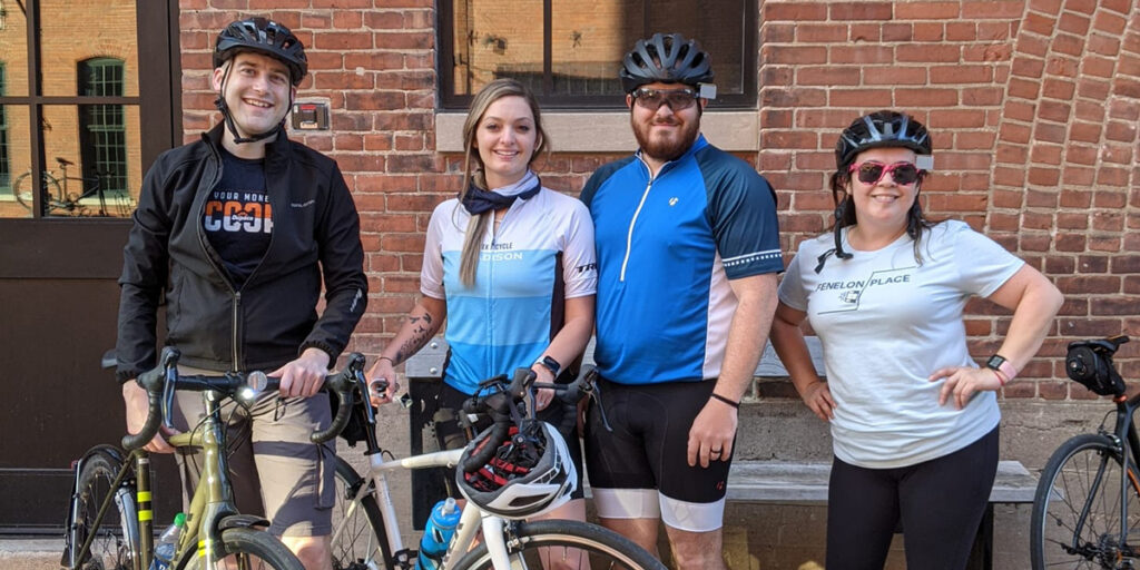 Dupaco's Robert Daughters (left) joins fellow Dupaco staff members for a group bike ride in the Millwork District in downtown Dubuque, Iowa.