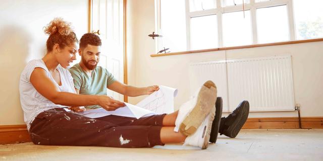 Couple looks at house plans together